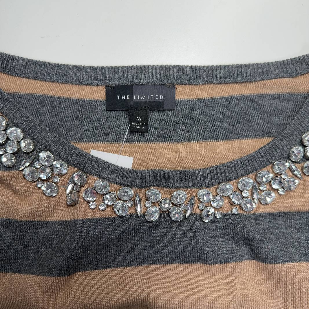 Beige and charcoal striped sweater with rhinestone embellished neckline, back view