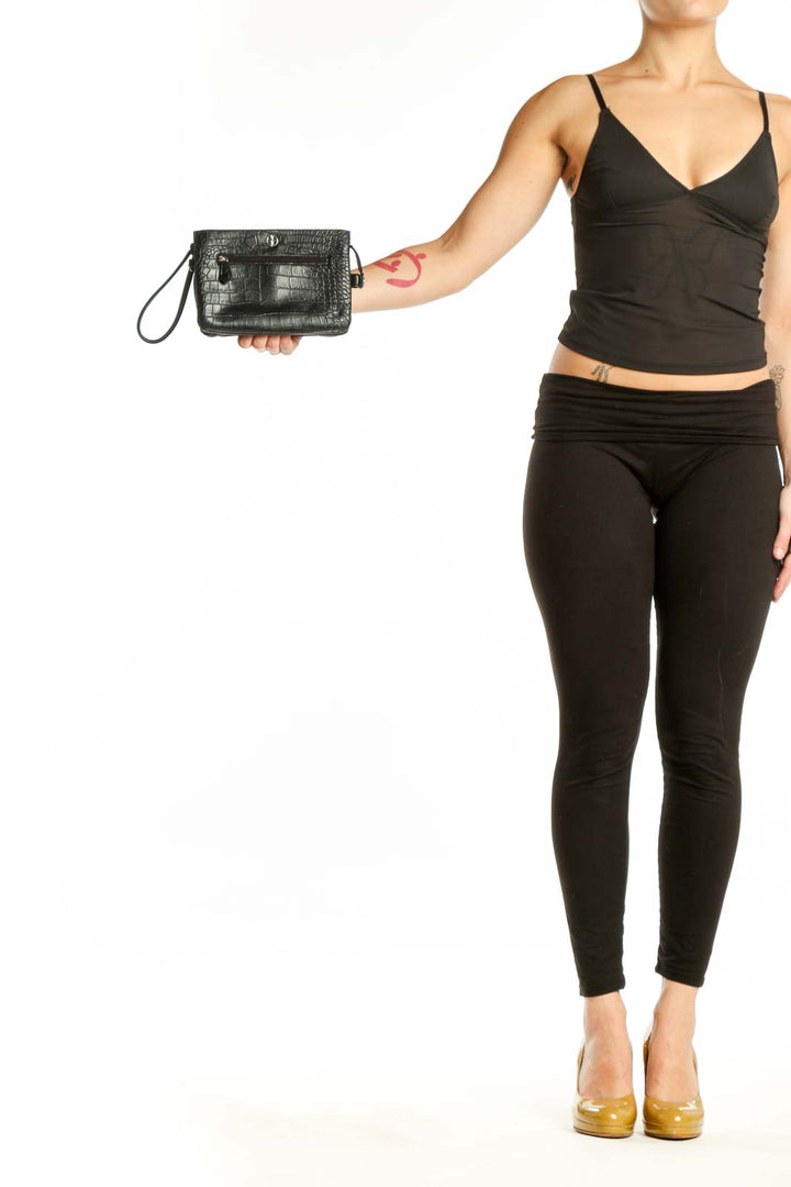Black crocodile-embossed clutch wristlet by Giani Bernini with detachable strap and front pocket detail