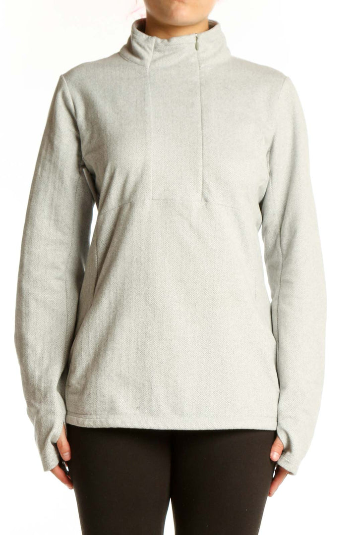 Cream Kyodan pullover sweatshirt with turtleneck and thumbholes, front view on model