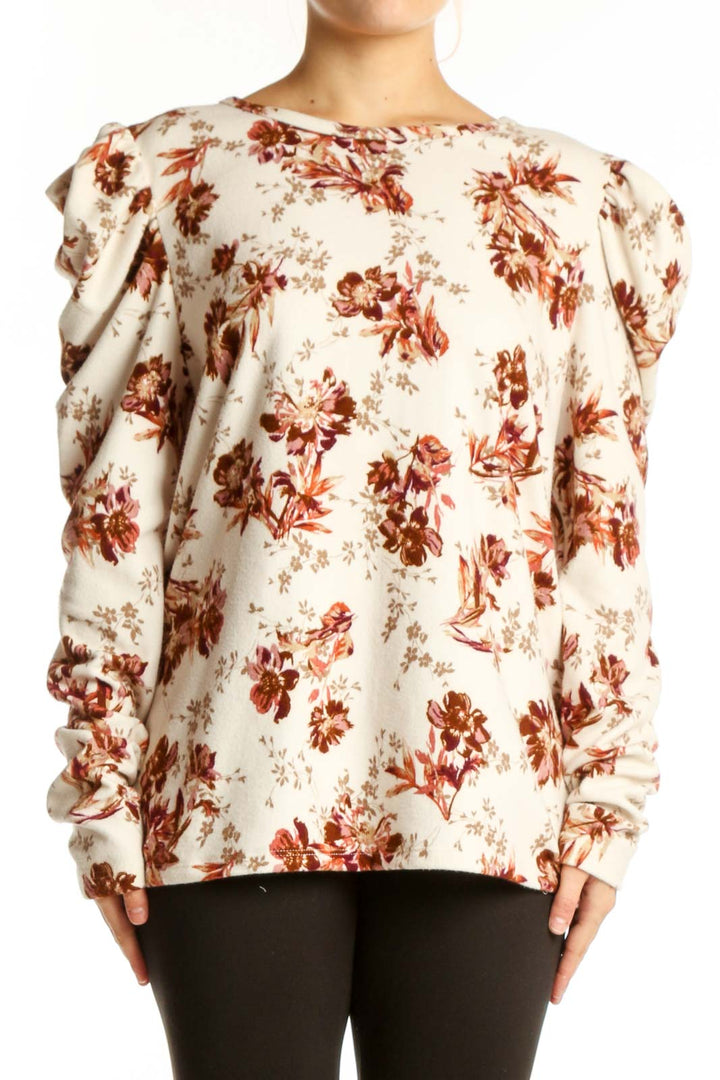 Cream floral blouse with burgundy botanical print and puff sleeves, front view on model
