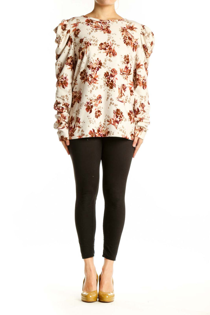 Cream floral blouse with burgundy botanical print and puff sleeves, front view on model