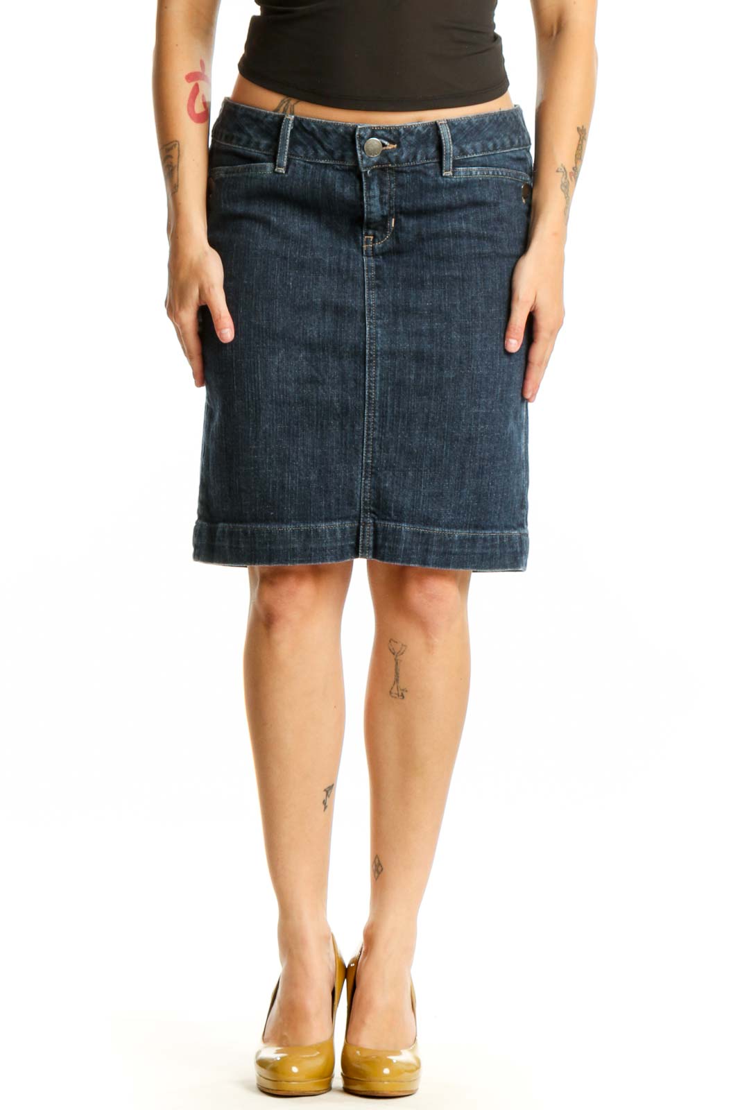 Dark blue denim knee-length skirt with rolled hem, front view on model wearing black top