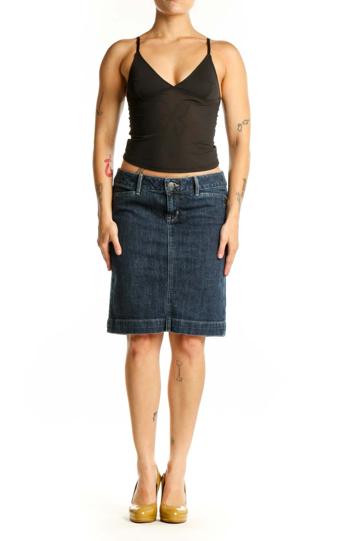 Dark blue denim knee-length skirt with rolled hem, front view on model wearing black top