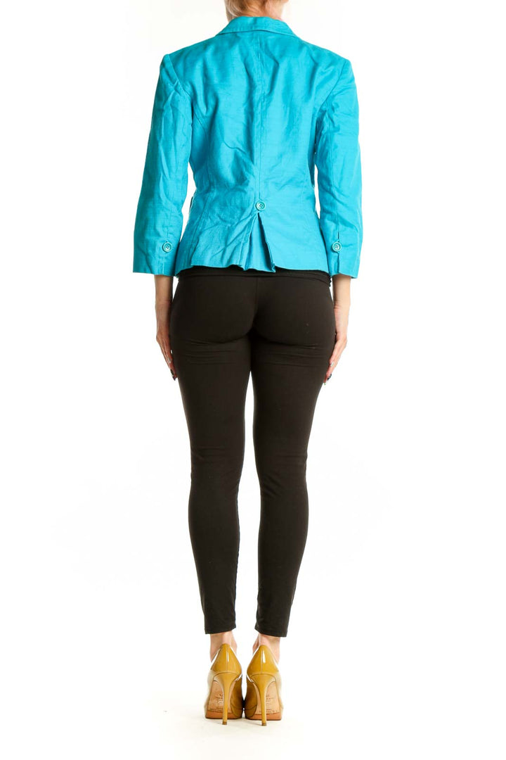 Back view of turquoise petite blazer showing tailored fit and cropped length