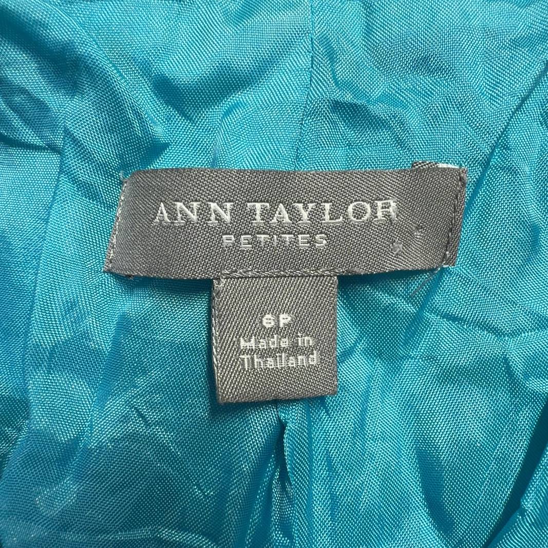 Tag view of turquoise petite blazer showing tailored fit and cropped length