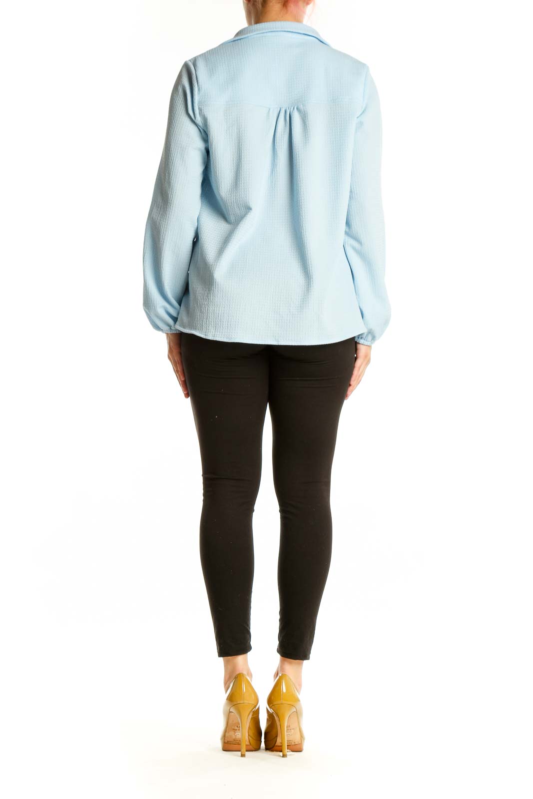 Back view of light blue collared pullover top showing relaxed fit and gathered sleeve cuffs