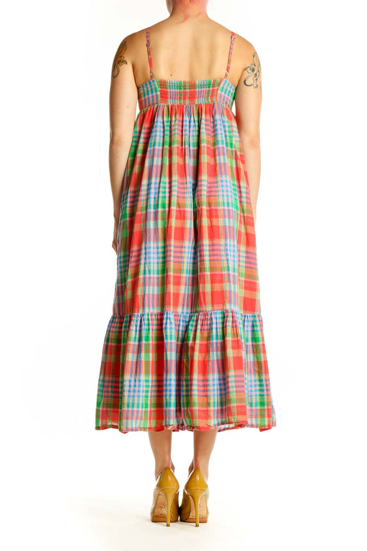 Back view of multicolor plaid cotton midi dress showing gathered bodice and tiered ruffle detail
