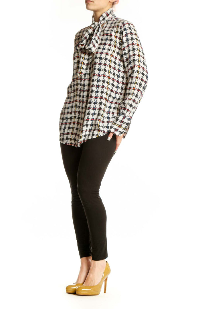 Front view of multicolor houndstooth silk blouse with pussy bow neckline by Equipment Femme