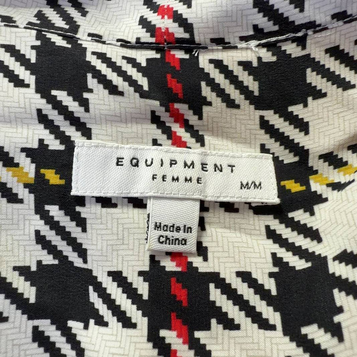 Tag view of multicolor houndstooth silk blouse showing button-up closure and long sleeves