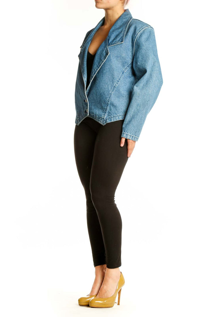 Front view of blue denim blazer with notched collar and single button closure