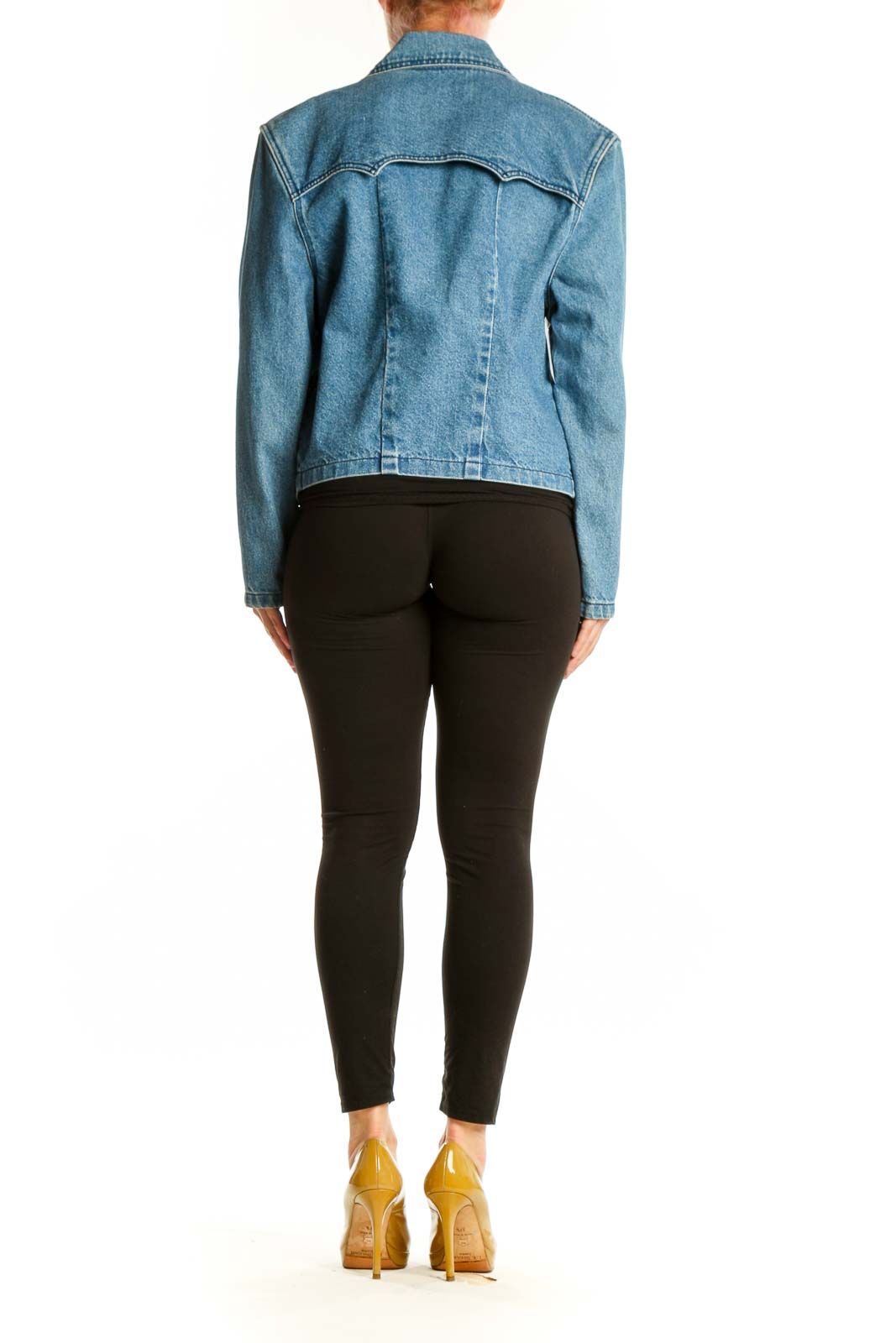 Back view of cropped blue denim blazer showing tailored fit and length