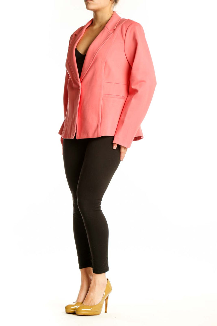 Front view of pink tailored blazer jacket with single-button closure and notched lapels