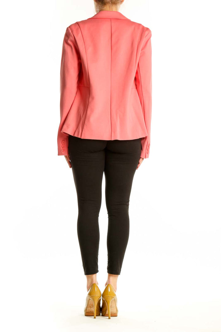 Back view of pink blazer jacket showing tailored silhouette and cropped length
