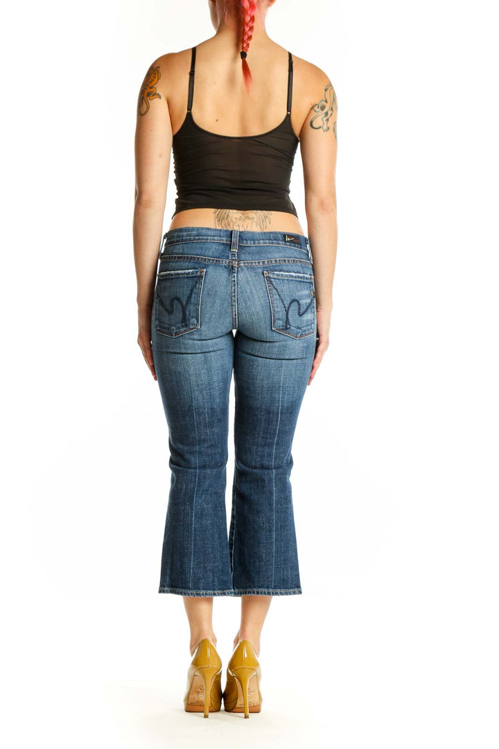 Back view of blue denim cropped flare jeans by Citizens of Humanity showing flattering flare cut and cropped length at knee