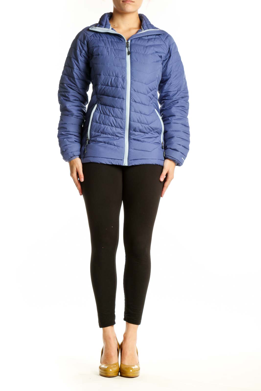 Navy quilted puffer jacket with white trim and full-length zipper, worn with black leggings