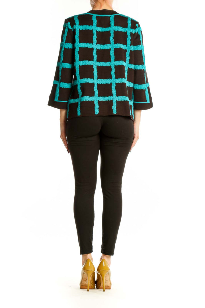 Turquoise and black geometric grid jacket by Magaschoni Collection, back view with three-quarter sleeves
