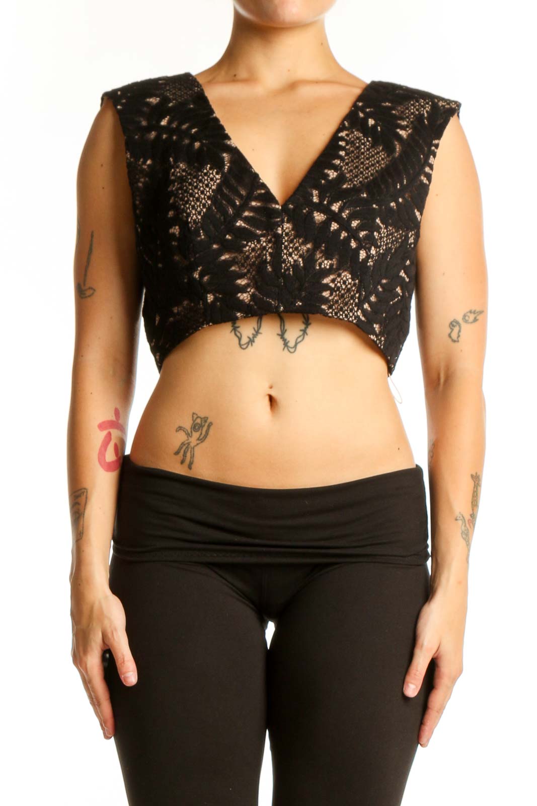 Black geometric lace crop top with V-neckline and tie detail, front view