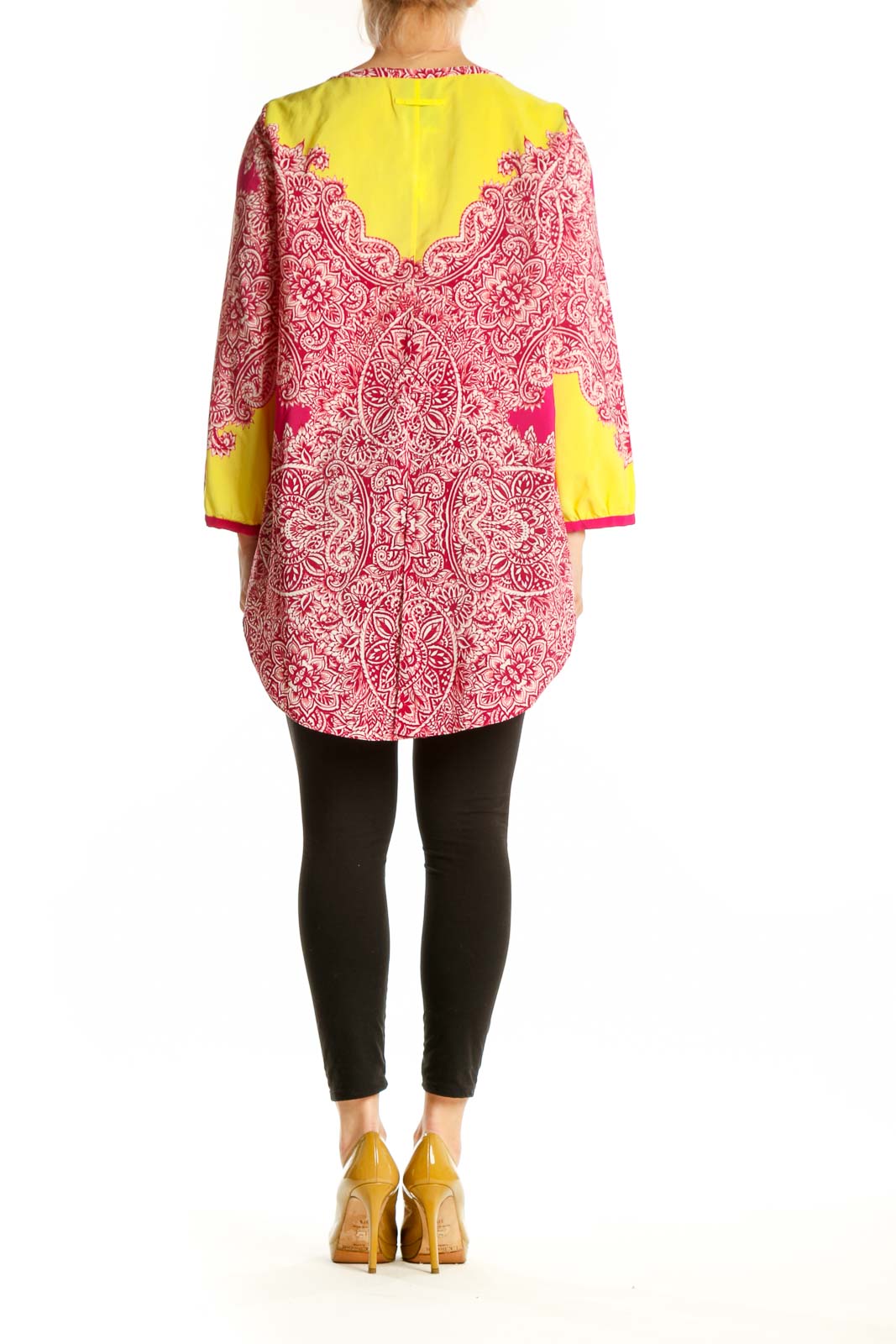 Back view of pink ornate paisley tunic top by Yoana Baraschi showing full length and magenta side panels with yellow trim