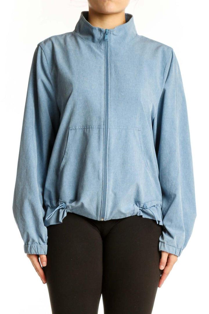 Front view of light blue denim windbreaker jacket with full-length zipper and mock neck collar