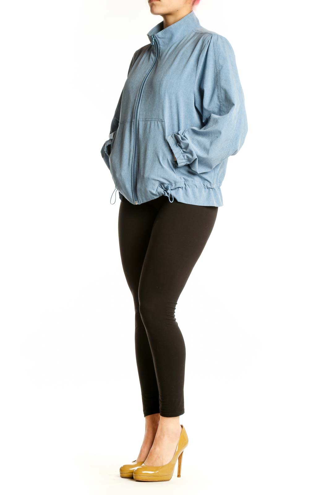 Front view of light blue denim windbreaker jacket with full-length zipper and mock neck collar
