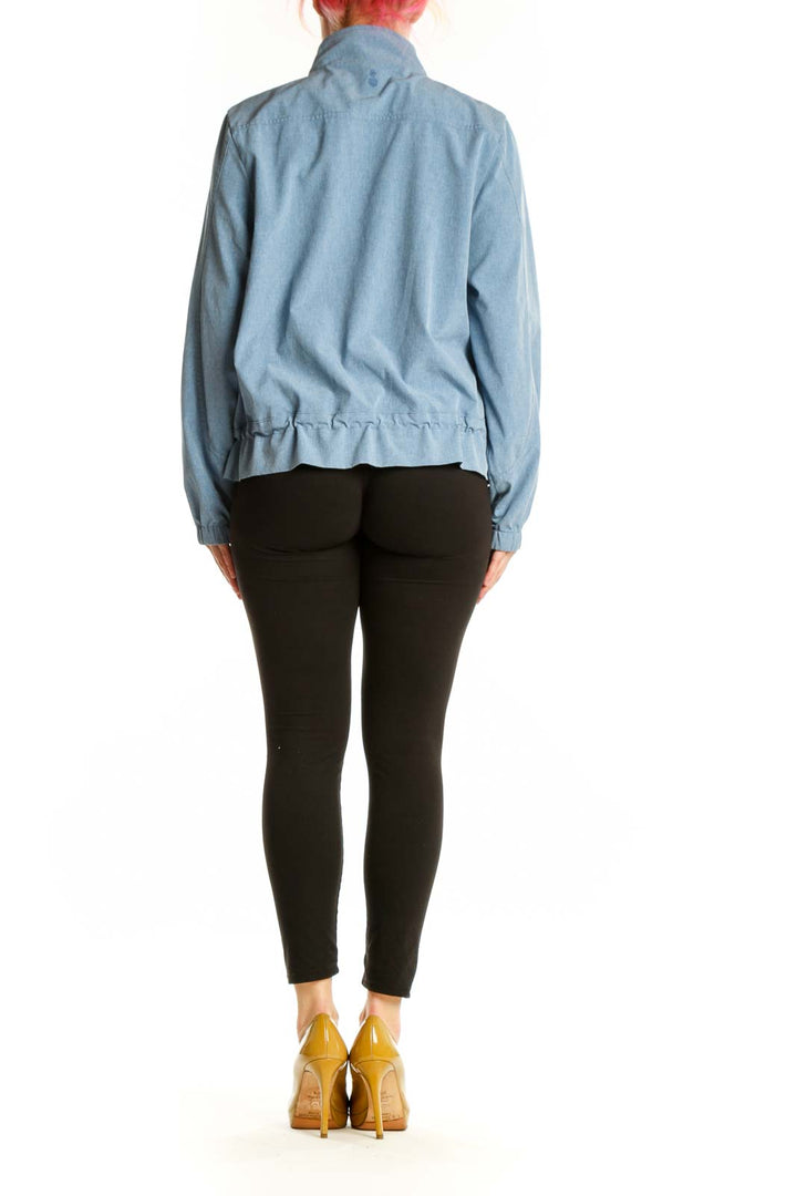 Back view of light blue denim windbreaker jacket showing drawstring hem details