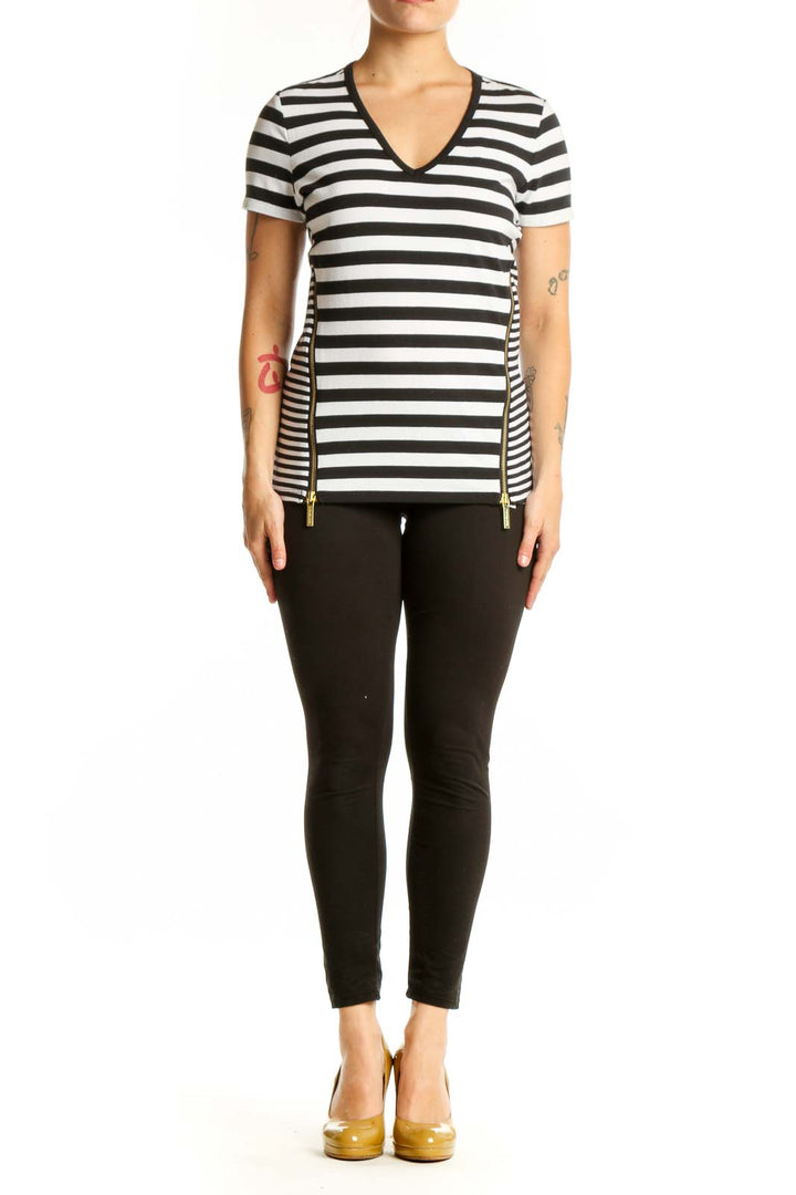 Black and white horizontally striped Michael Kors v-neck top with short sleeves and gold side zip details, front view
