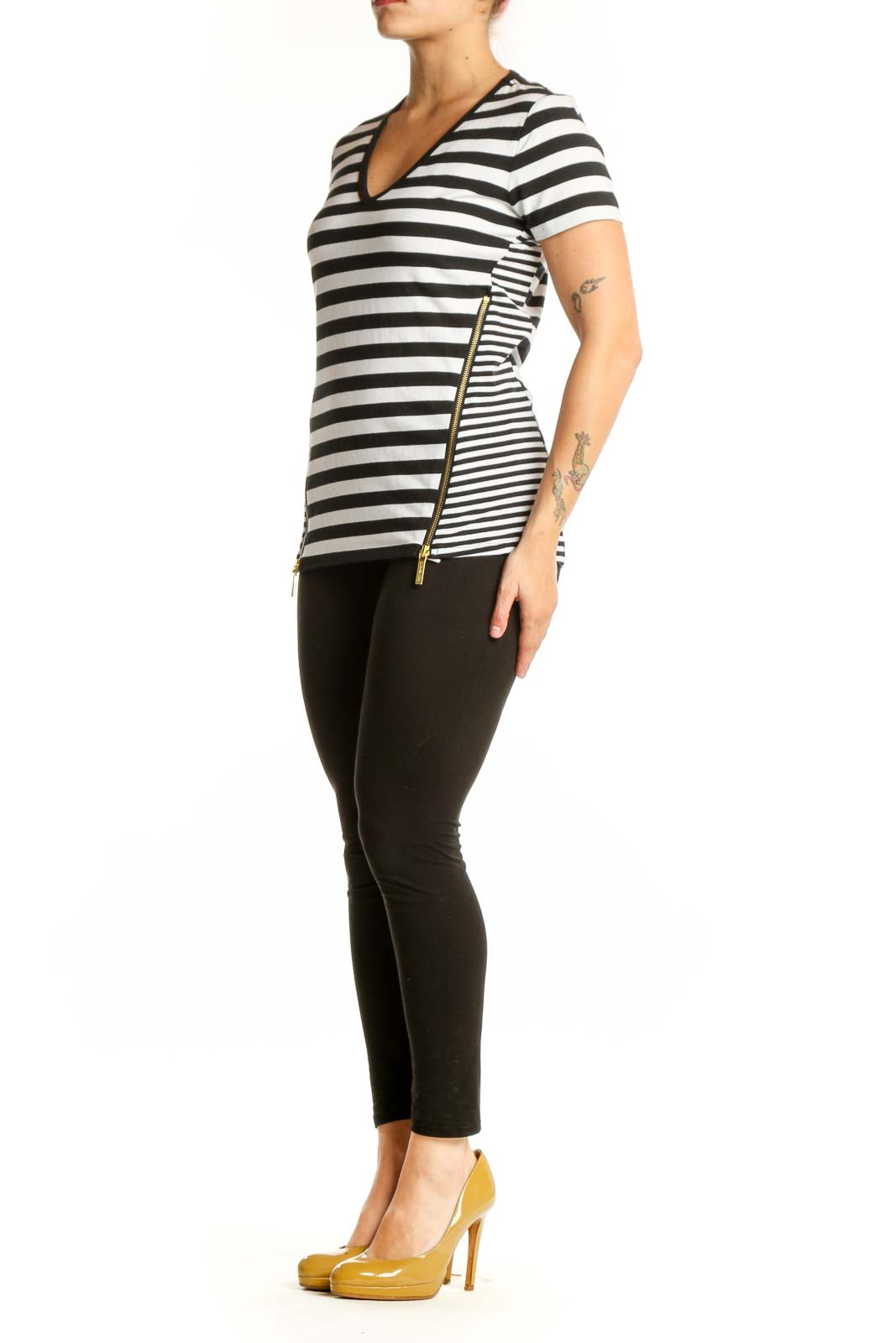 Black and white horizontally striped Michael Kors v-neck top with short sleeves and gold side zip details, front view