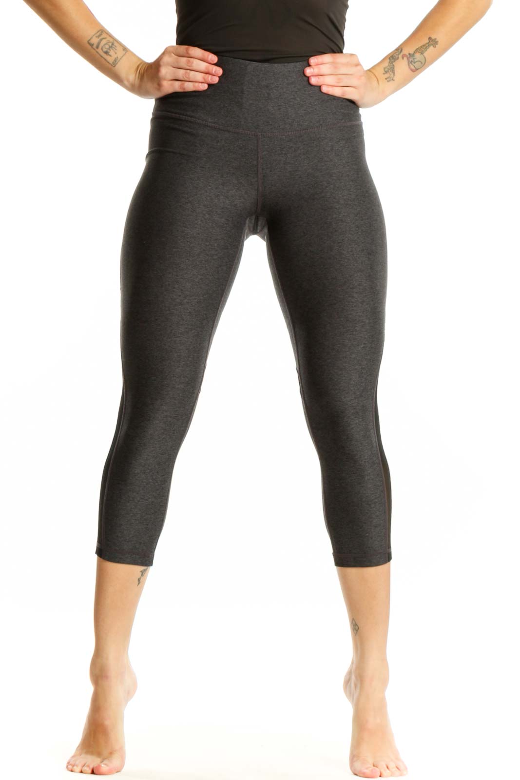 Front view of charcoal capri leggings with mesh panels and high-waisted fit