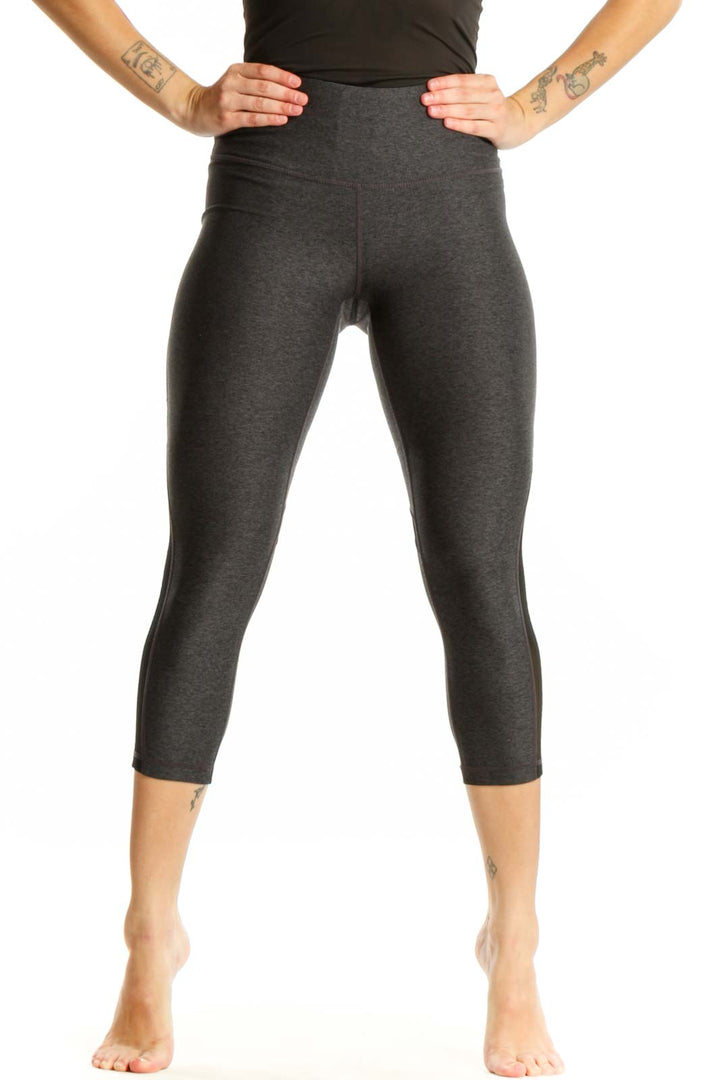 Front view of charcoal capri leggings with mesh panels and high-waisted fit