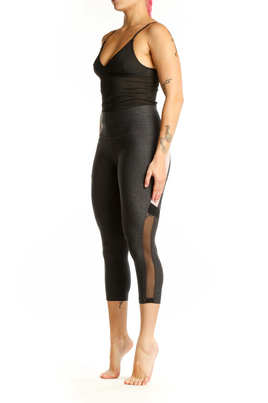 Front view of charcoal capri leggings with mesh panels and high-waisted fit
