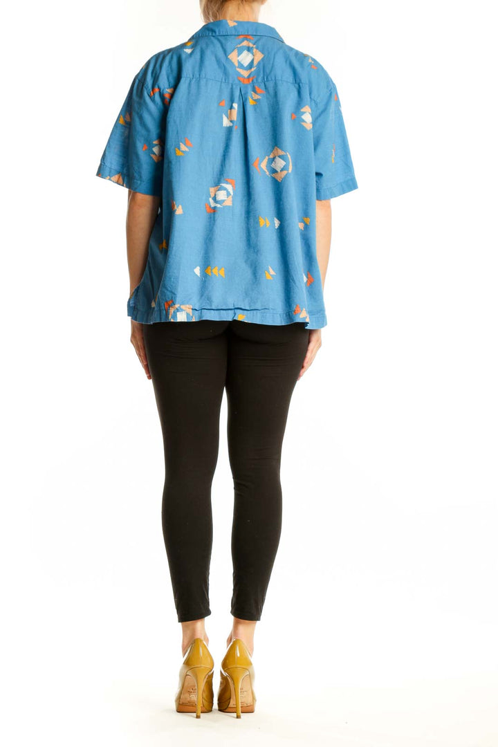 Blue abstract geometric print cotton button-up shirt, back view showing relaxed fit