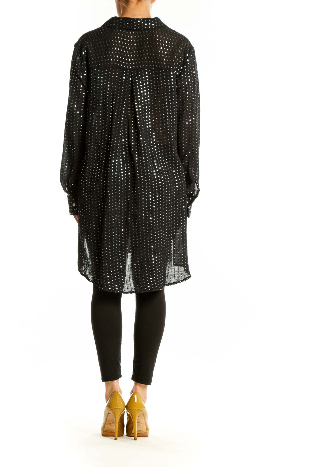 Back view of black sequin shirt dress showing high-low hemline and oversized silhouette