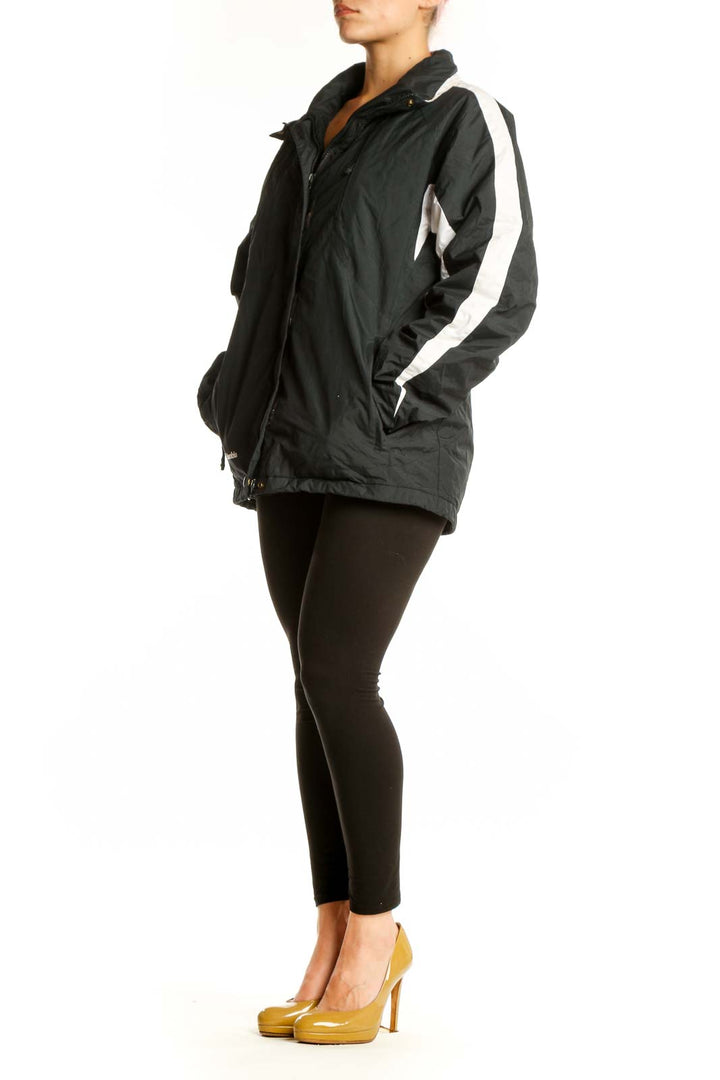 Black Columbia windbreaker jacket with white stripe accents, hooded design, front view on model