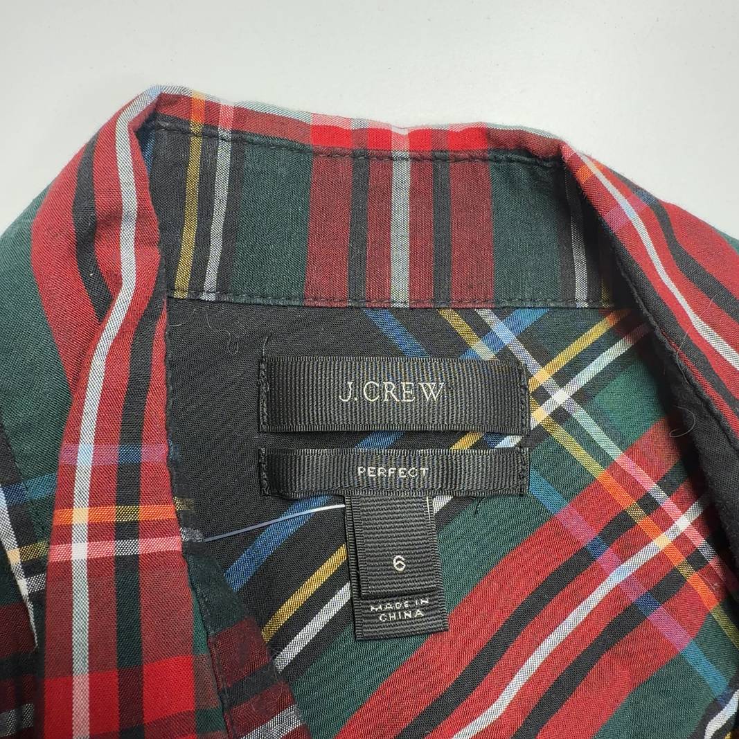 Red and black plaid cotton button-up shirt by J.Crew, back view on model