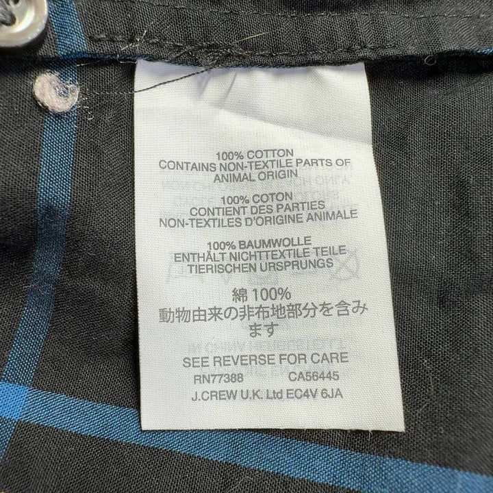 Red and black plaid cotton button-up shirt by J.Crew, back view on model