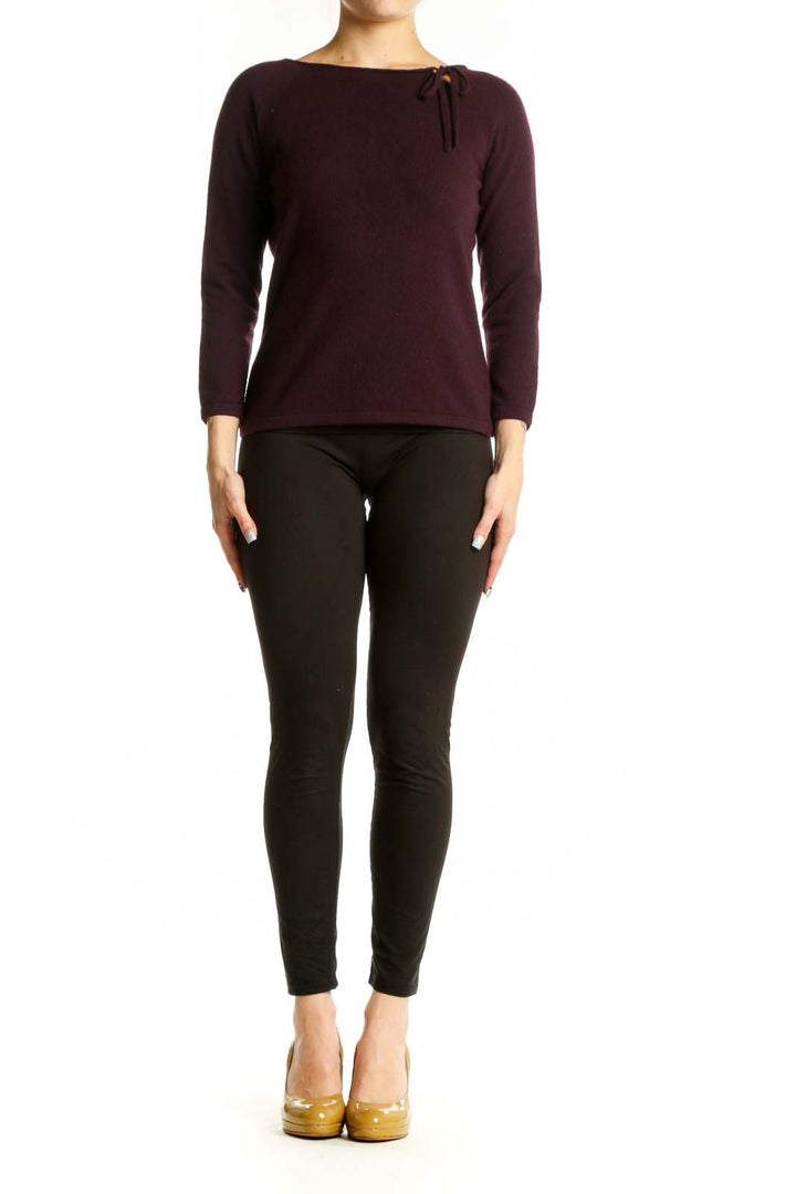 Burgundy long sleeve knit top with tie neckline detail, front view on model