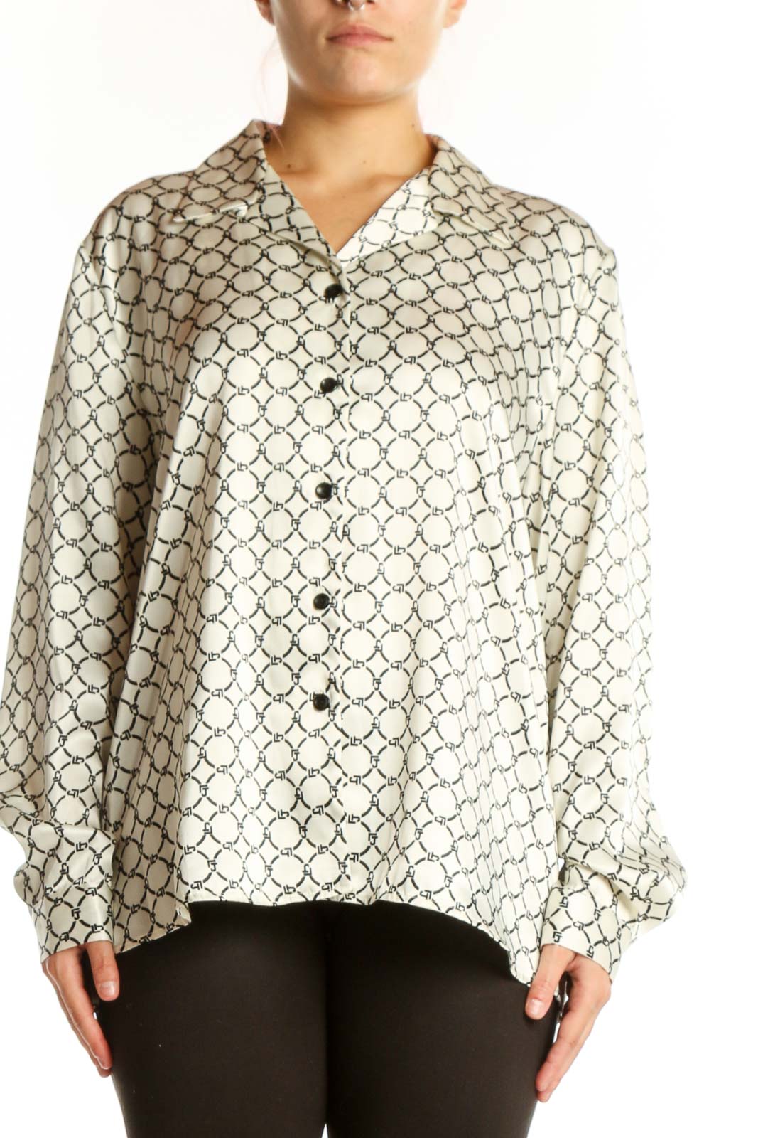 Cream geometric print button-up blouse with black pattern, front view on model