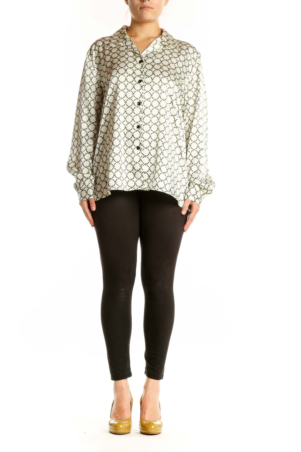 Cream geometric print button-up blouse with black pattern, front view on model