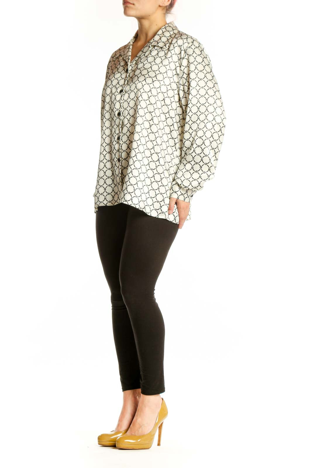 Cream geometric print button-up blouse with black pattern, front view on model