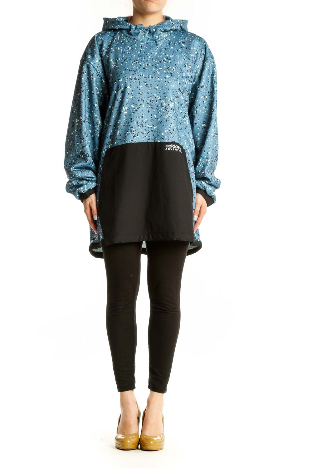 Adidas blue speckled cropped hooded jacket with white splatter pattern and black contrast panel, front view on model