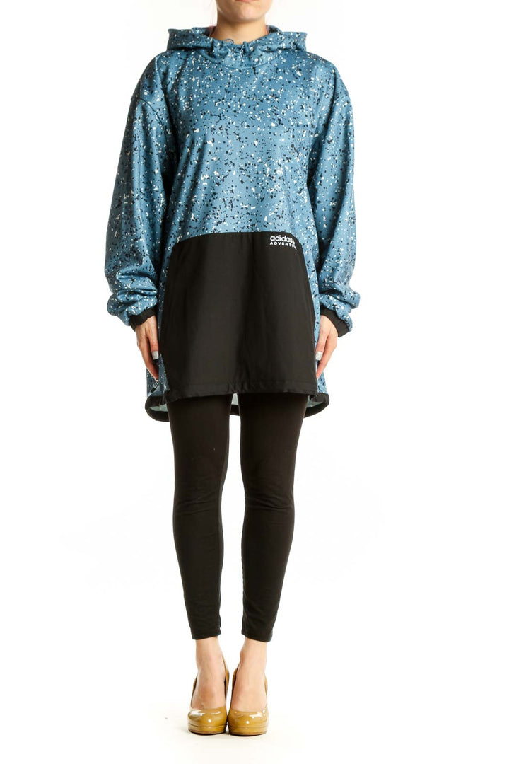 Adidas blue speckled cropped hooded jacket with white splatter pattern and black contrast panel, front view on model