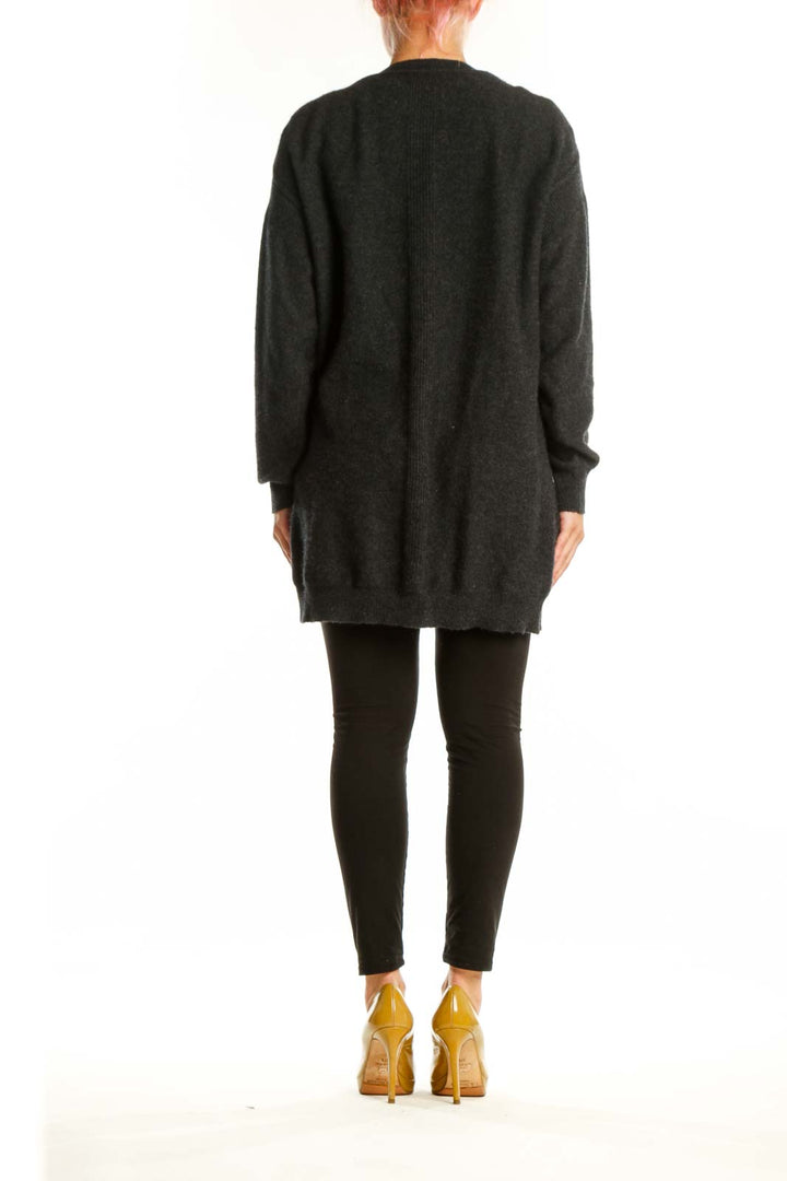 Charcoal cashmere button-front cardigan with pockets, back view showing relaxed fit and longer length