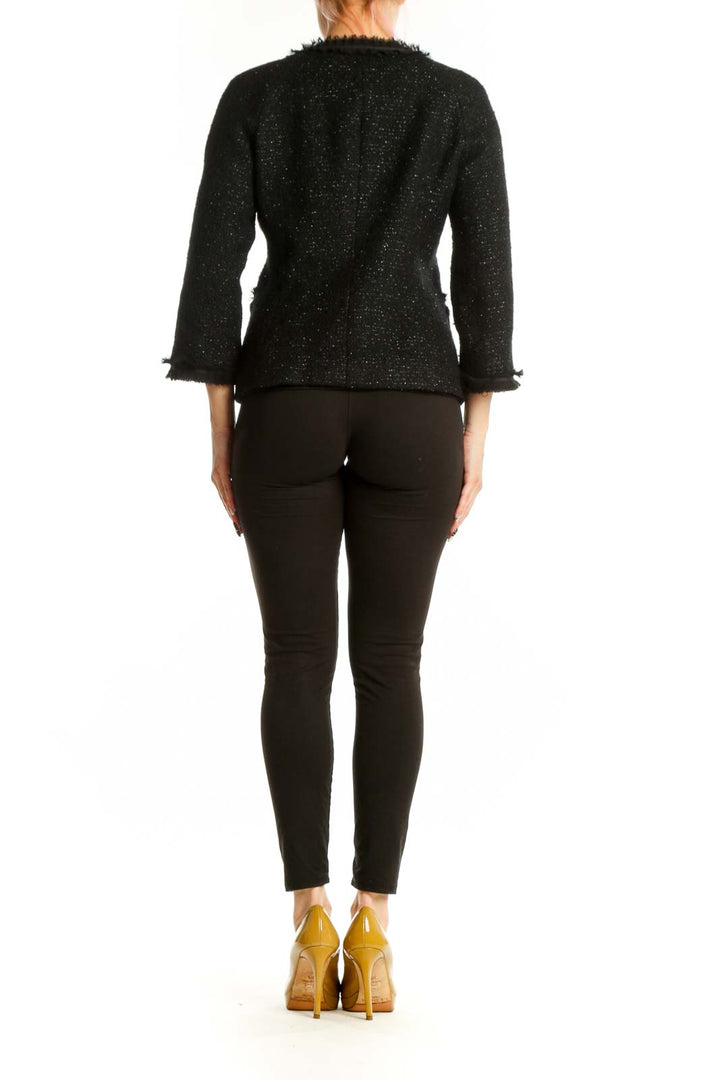 Black sparkle wool blend jacket with three-quarter sleeves and frayed trim, back view