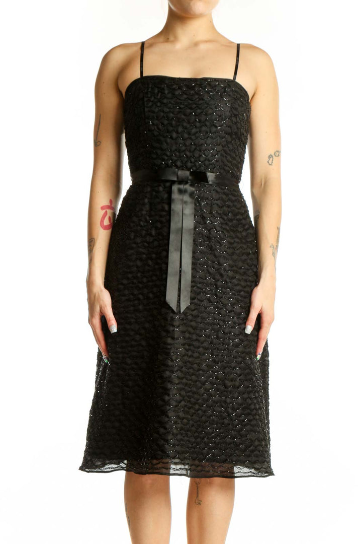 Black sequin strapless cocktail dress with silk ribbon belt, front view