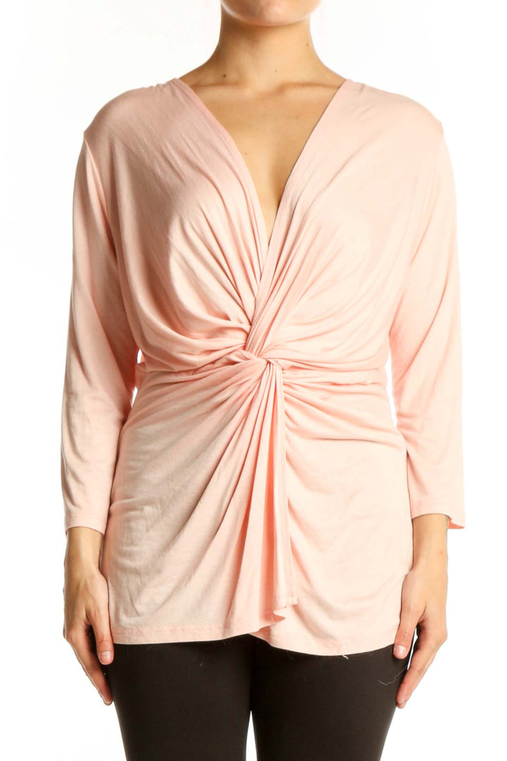 Pink twisted front top with V-neckline and 3/4 sleeves by IN JOY CLOTHING, front view
