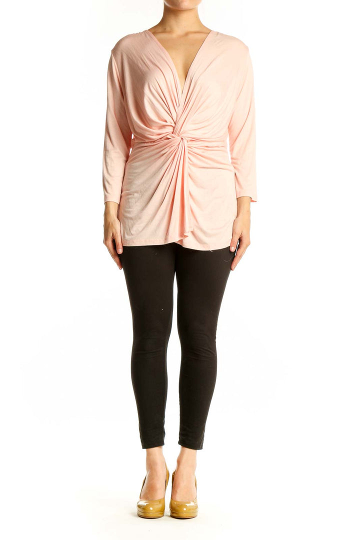 Pink twisted front top with V-neckline and 3/4 sleeves by IN JOY CLOTHING, front view