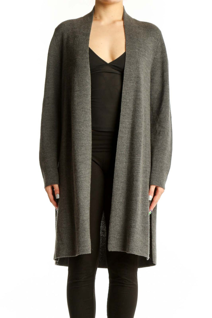 Gray merino wool open cardigan by Eileen Fisher worn over black top, front view