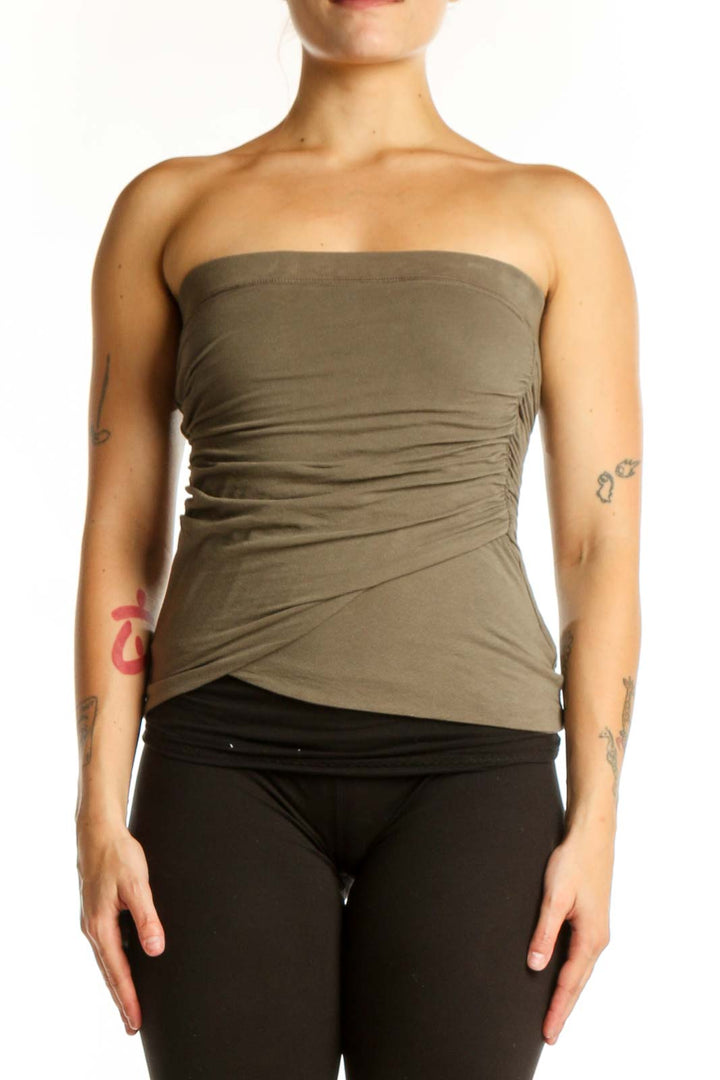 Olive green strapless ruched top with wrap-style design, front view on model