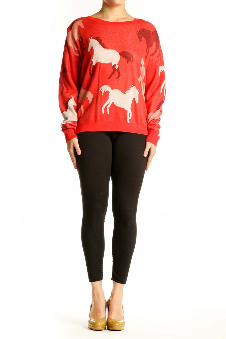Red horse print knit sweater with cream and burgundy horse motifs, worn with black leggings