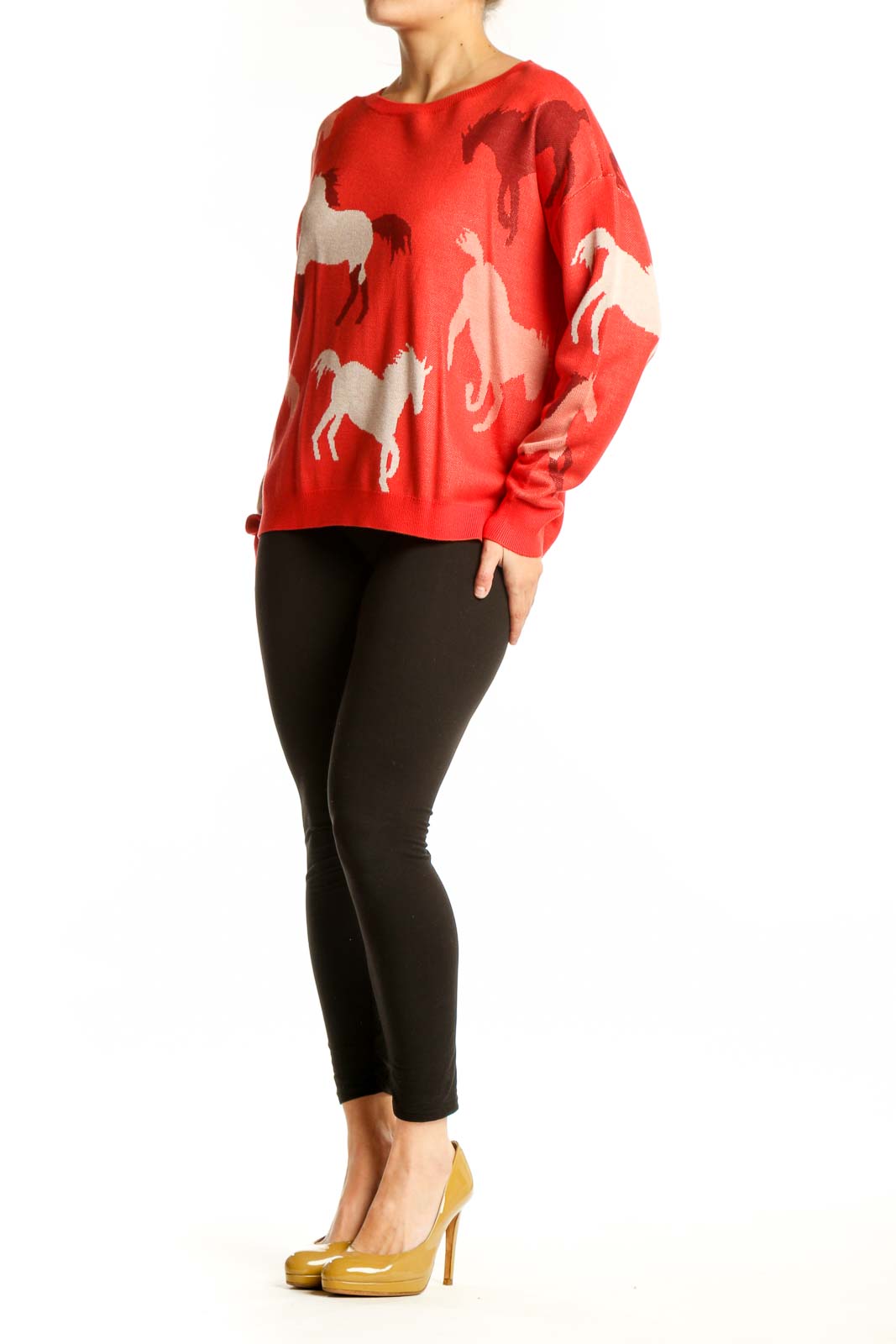 Red horse print knit sweater with cream and burgundy horse motifs, worn with black leggings